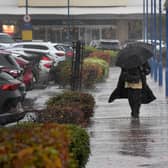 Shoppers get caught in the storm at Bentley Bridge, Wednesfield.
Tim Thursfield/Iconic Media Group

