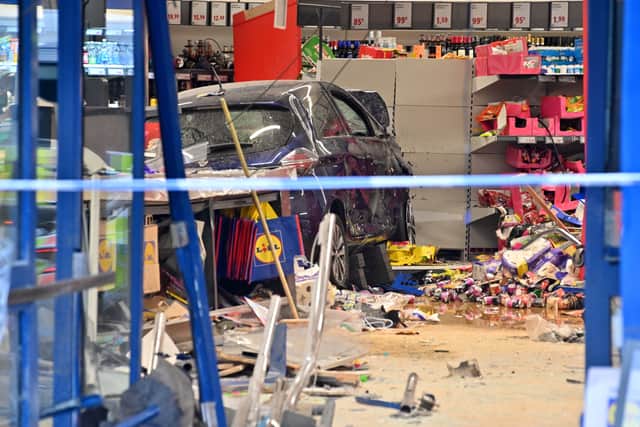 The car had gone through the front doors and crashed into the back of the store