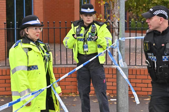 Police officers remained stationed outside the store