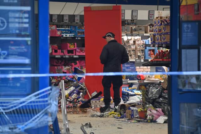 Officers from West Midlands Police could be seen working inside the store
