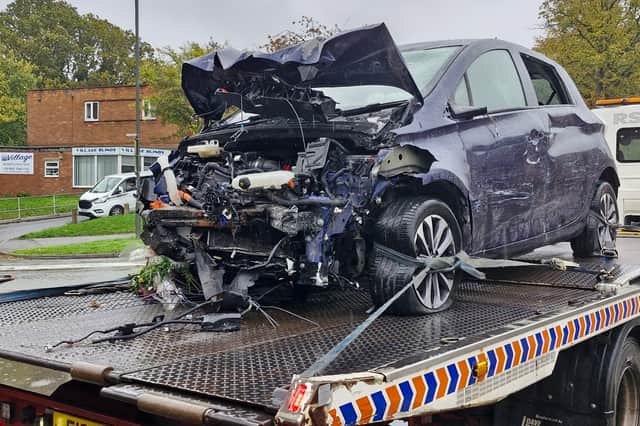 The front of the car was completely destroyed, with debris and detritus visible
