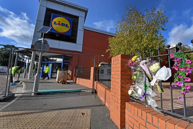 The wall outside Lidl has been the place for people to put out tributes