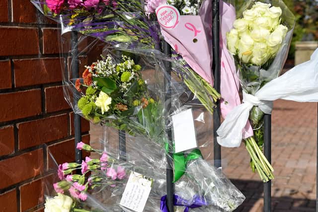 The tributes were being placed on the wall in a range of colours