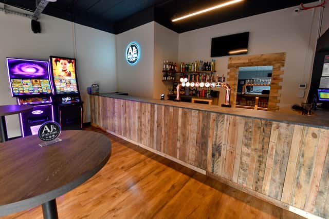 The bar is modern and fully stocked for all needs