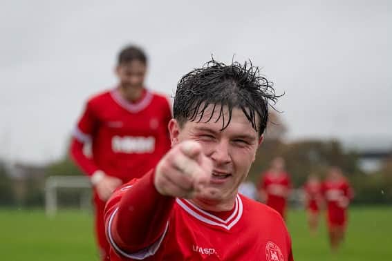Brenden Parker celebrates his goal for Stafford Town.