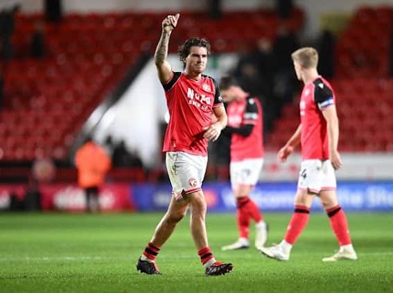 Mason Hancock applauds the Walsall fans at full-time.
