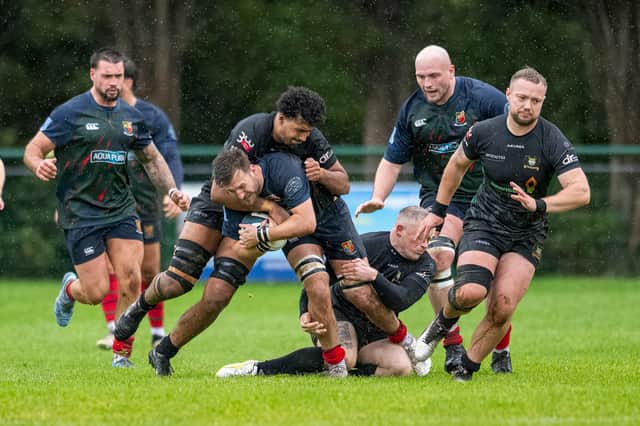 Lichfield's Ben Bourne brought to a halt.