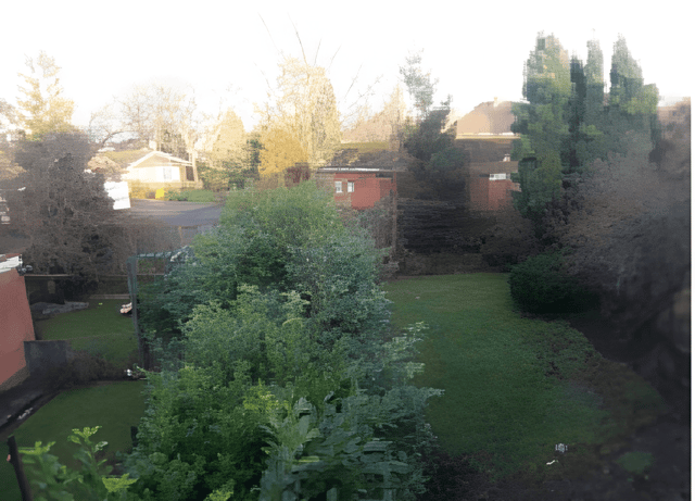 An enclosed, landscaped rear garden provides a private outdoor retreat, with a low-maintenance design suited to relaxing or entertaining.