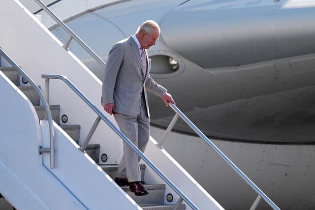 Charles descends from Voyager at Lynden Pindling International Airport, in Nassau (Aaron Chown/PA)