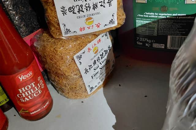 Mouse droppings found in store room on shelf next to food items