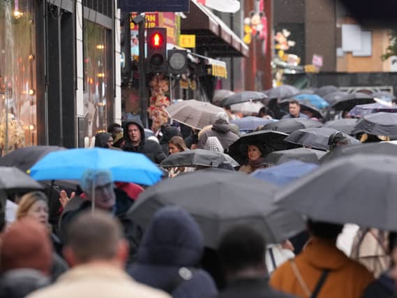 Shoppers under umbrellas as the rain falls in Oxford Street, London
