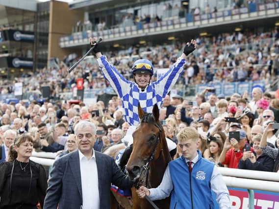 Saffie Osborne celebrates after winning the St Leger on Highwayman