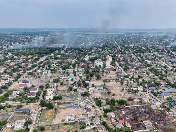 Smoke rises from a residential neighbourhood in the Russian-occupied city of Oleshky in Ukraine