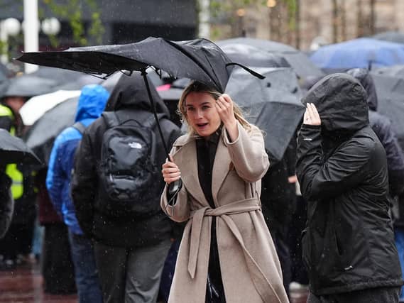 A woman holding an umbrella