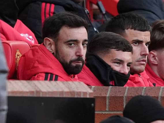 Bruno Fernandes (left) on the substitutes' bench for Manchester United's defeat against Bournemouth
