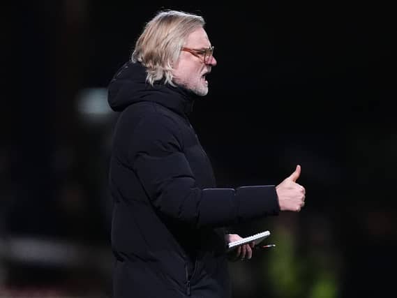 Steven Pressley looks on