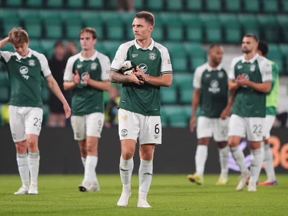 Jason Kerr (centre) reacts