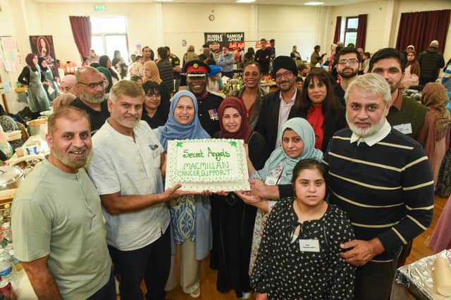 Front: The Akhtar Family, Back L-R Sajid Bashir, Alvina Ali from Secret Angels with Deputy Lieutenant Martin Levermore MBE DL, Warinder Juss MP for Wolverhampton West and Wolverhampton North East MP Sureena Brackenridge