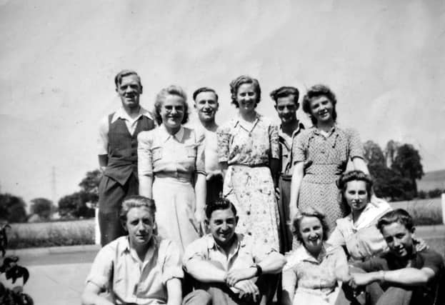 PICTURE FROM THE ARCHIVE: Office staff at Alveley Colliery took a well-earned break in the summer sunshine when they gathered outside the pithead for this group snapshot back in 1948. The 11-strong team, captured smiling on the colliery grounds, traded their paperwork and ledgers for a brief pause in front of the lens. Pictured in the back row are (from left) Tom Cadwallader, Olive Link, Dennis Bache, Doreen Giles, Ted Warrington, and possibly Joan Childs. Taking a seat at the front are (from left) Harold Powell, Wilbur Lloyd, Marie Price (née Robinson), Denise Davies, and Keith Holford.