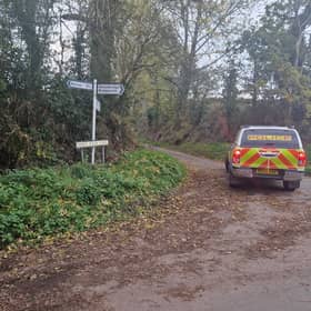 Police at the east end of Sheep Walk Lane near Kinver where a burnt-out car with a body inside was found