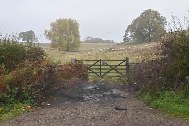 Blackened ground in Sheep Walk Lane, where the car was found