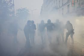 Police in France enveloped by smoke