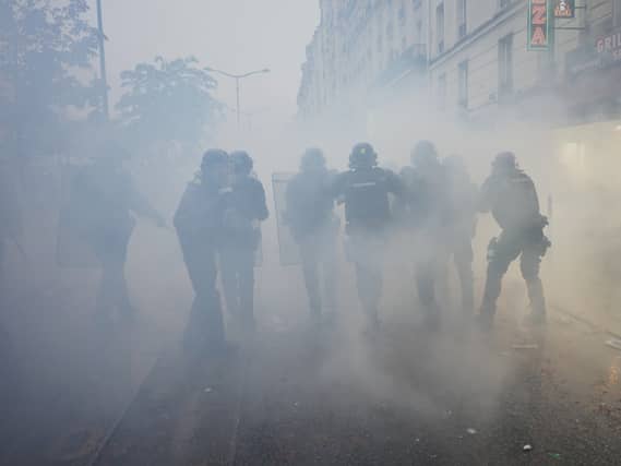 Police in France enveloped by smoke