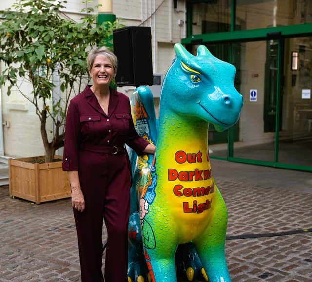 Compton Care's CEO Rachel Overfield with a dragon sculpture, for Trail of the Dragons, coming in summer 2027