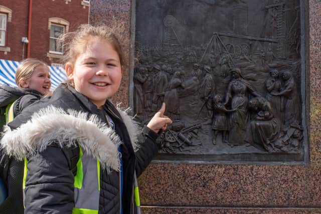 Pupils study the public sculpture honouring Sister Dora, created by artist Francis John Williamson, which is situated at The Bridge, in Walsall town centre.