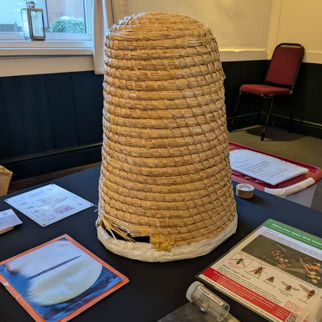 A traditional Skep hive made from woven straw. Used today by Alison to collect swarming bees.