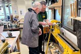 Ian shows Cyd wood turning skills