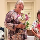 Potty Plotters Elaine & Julia with flowers grown on their allotments