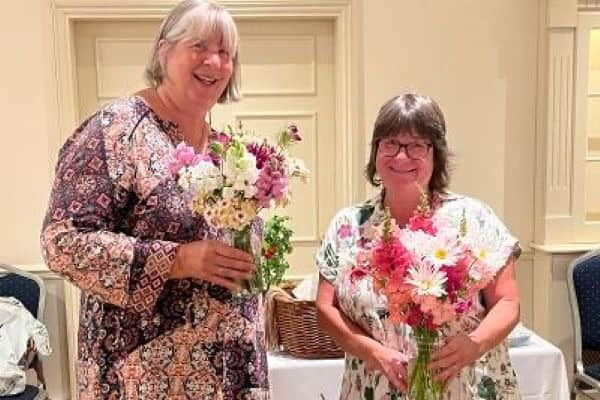 Potty Plotters Elaine & Julia with flowers grown on their allotments