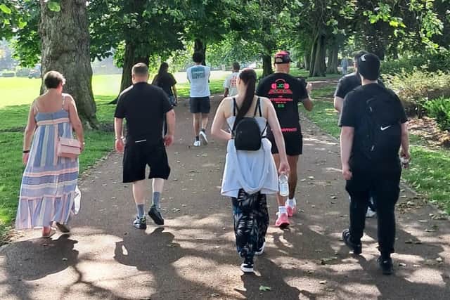Wellness Running Club: Participants walking and running through West Park