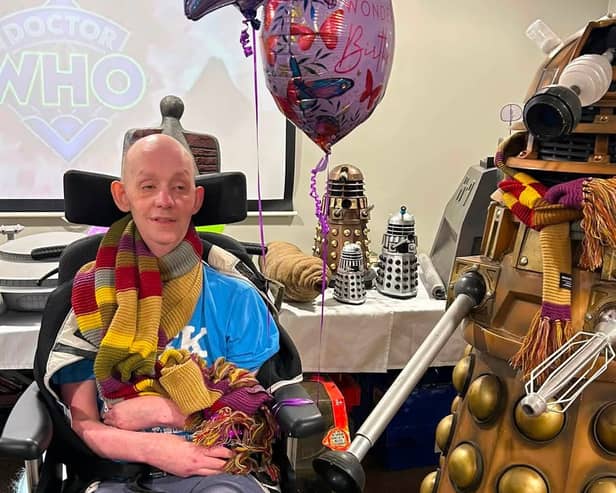 Resident Richard Mortan with the life-sized props