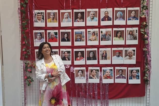 Curator Suffia Perveen with portraits featured in the Cultural Connections exhibition at Wolverhampton Art Gallery.