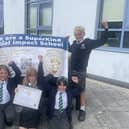 Pupils celebrate their award and hard work