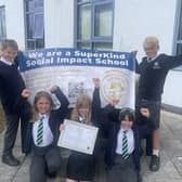 Pupils celebrate their award and hard work
