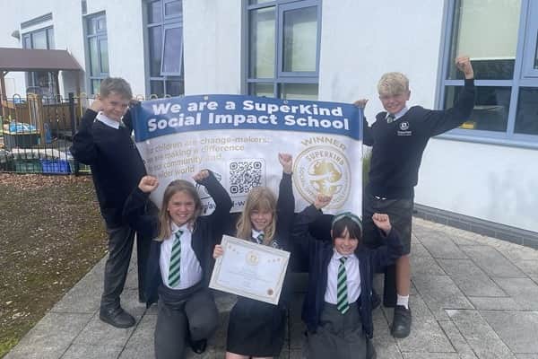 Pupils celebrate their award and hard work