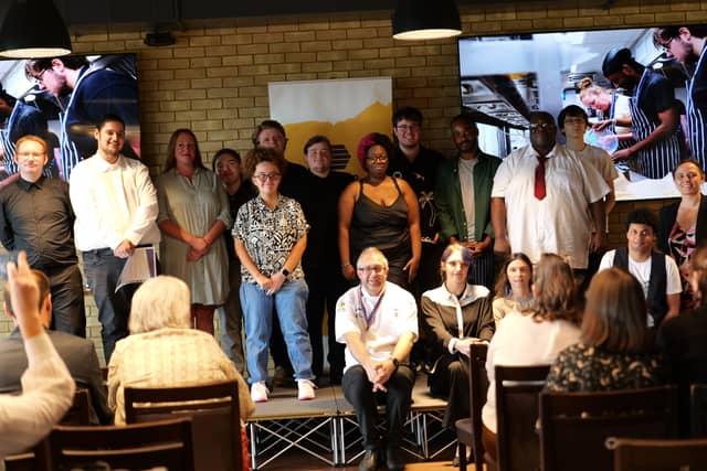 Graduates assemble! Successful Catering Club participants with those who have helped them through the course.