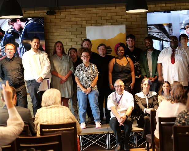 Graduates assemble! Successful Catering Club participants with those who have helped them through the course.