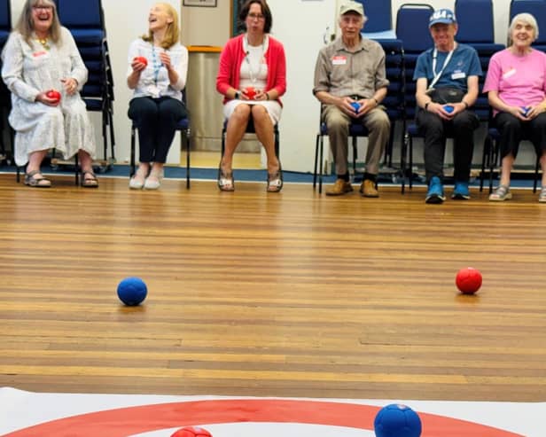 Boccia is a precision target sport played indoors from a seated position