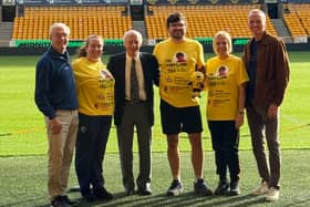 John Richards, Alan Morgan and Geoff Thomas pictured with the 'Taylor trekkers'. 