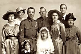 The book details the search by Colin Reid for information about Claude, pictured with Violet and her family on their wedding day in May 1918