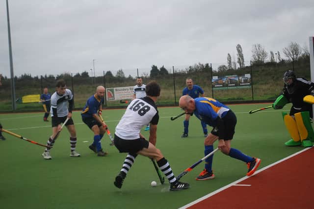 Stourport's Steve Taylor jabs to clear.