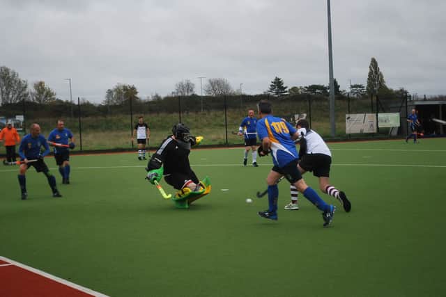 Stourport's keeper saves from Worcester 4th's.