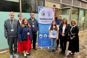 Janet Higgins and Julie Wood stand with Walton Hall Academy pupils