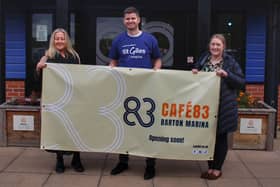 Outside Café 83 at Barton Marina are Jess Avery, Community Fundraising Manager, Ben Shaw, Senior Communications and Marketing Officer, and Lisa Thompson, Community and Events Support Officer, who are getting the café ready for its unveiling next week.