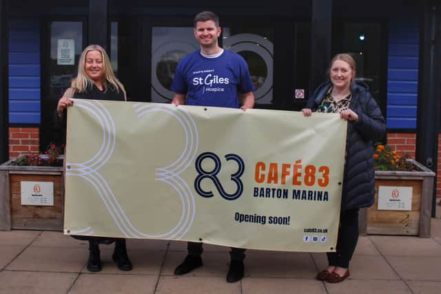 Outside Café 83 at Barton Marina are Jess Avery, Community Fundraising Manager, Ben Shaw, Senior Communications and Marketing Officer, and Lisa Thompson, Community and Events Support Officer, who are getting the café ready for its unveiling next week.