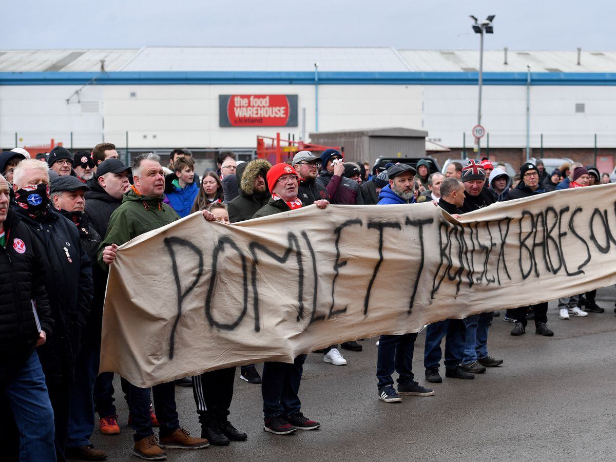 Walsall fans protest about the board at Banks's Stadium.